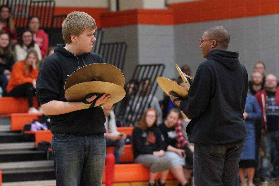 Keeping the beat, freshman Jesse Wall and sophomore Ty West play their cymbals.