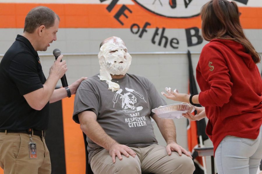 Taking it like a champ, Principal Hilliard accepts the Pie In The Face without a flinch.
