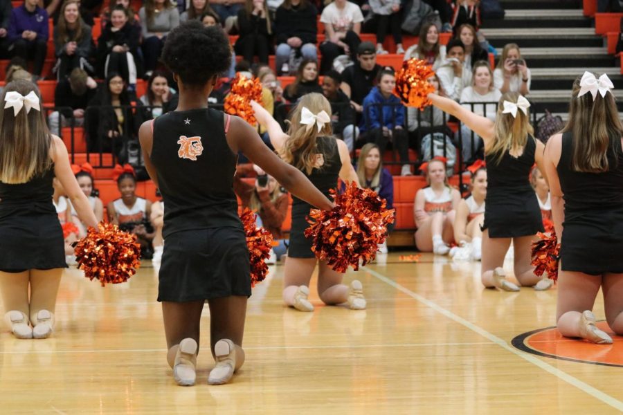 Performing to a drumline cadence, the Dazzlers dance with drive.