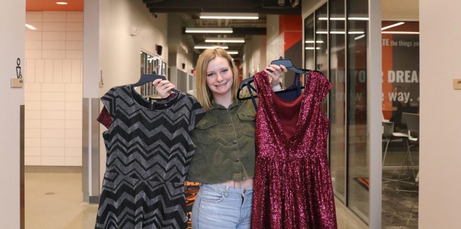 Junior Paige Swartz shows off some of the dresses she’s collected as part of her senior project.
