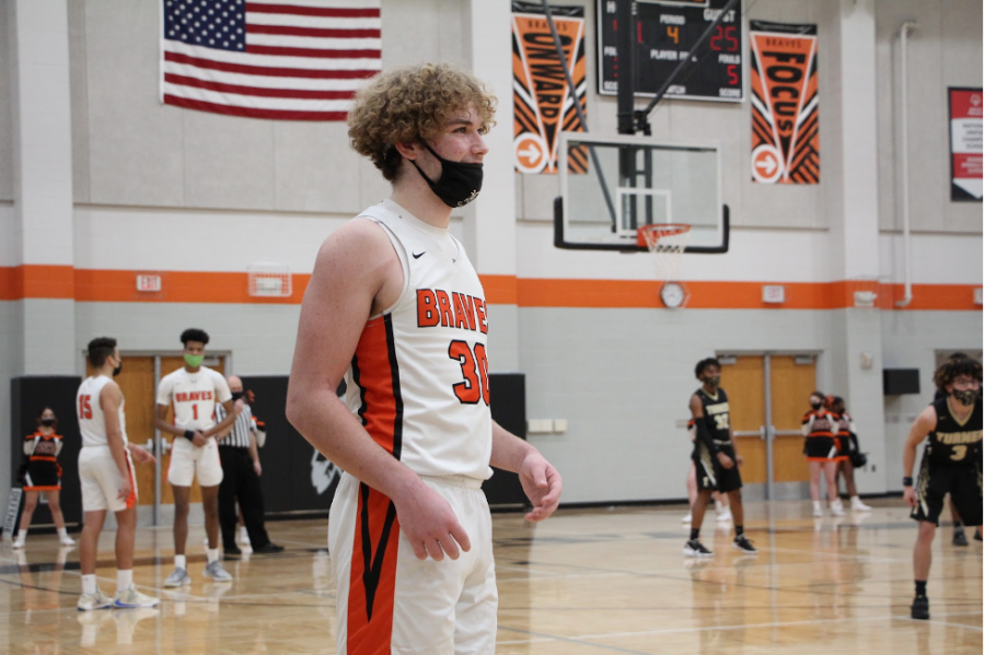 Junior Jayce Smith waits for the ref to hand him the ball to throw it in.