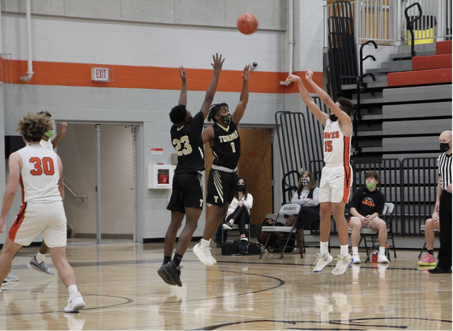 Sophomore Tavian Cruse shoots a three-pointer.