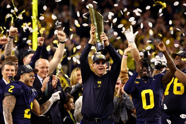 HOUSTON, TEXAS - JANUARY 8: Head coach Jim Harbaugh of the Michigan Wolverines celebrates after defeating the Washington Huskies 34-13 in the 2024 CFP National Championship game at NRG Stadium on January 8, 2024 in Houston, Texas. (Photo by Jamie Schwaberow/Getty Images)